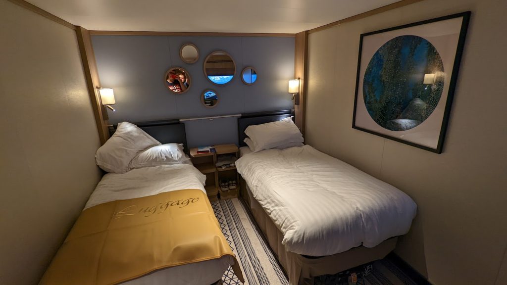 An interior cabin on P&O Iona, setup with twin beds.